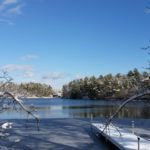 The frozen pond under a blue sky in Plymouth, Massachusetts
