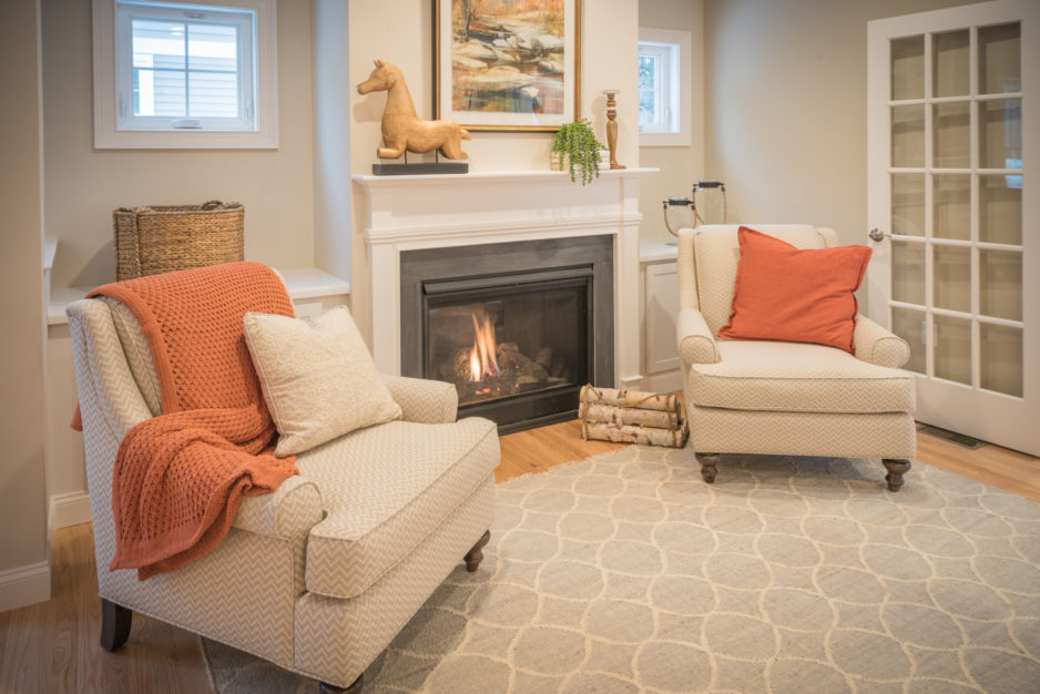 A classic living room setting, fireplace included, awaits in Plymouth.
