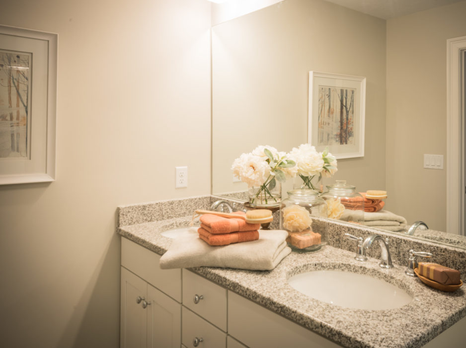 Luxurious toiletries sit atop the bathroom sink.